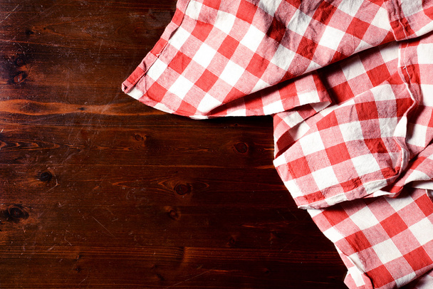 top view of checkered napkin on wooden table - Photo, Image