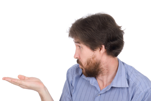 The man with a beard showing something on the palm of her hand - Photo, image