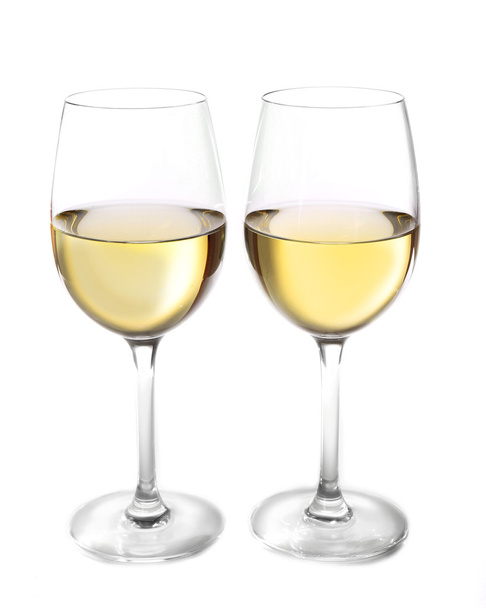 Two  glasses of wine on light background - 写真・画像