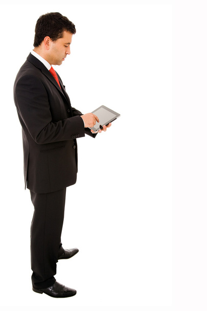 Young businessman using a tablet pc - Zdjęcie, obraz