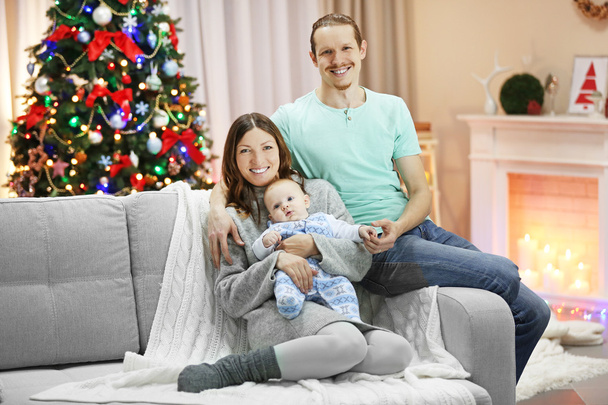 Happy family on sofa in Christmas room - Φωτογραφία, εικόνα