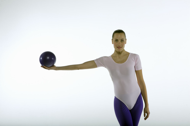 woman gymnast practising with ball - Фото, изображение