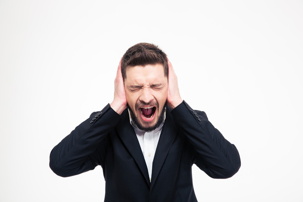 Businessman covering his ears and screaming  - Foto, Bild