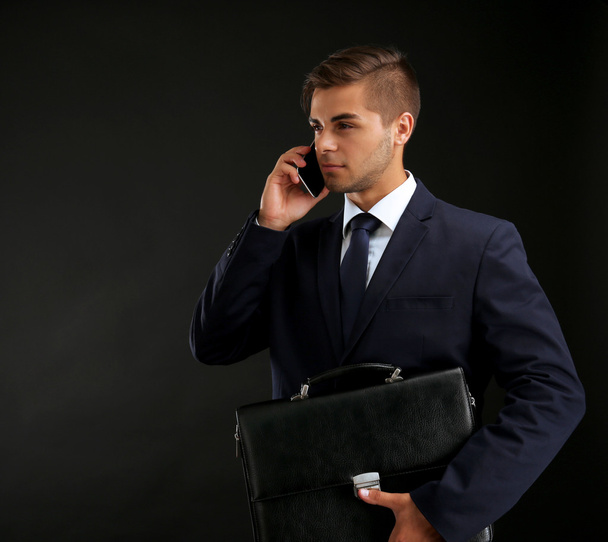 Elegant man in suit with briefcase  - Фото, изображение
