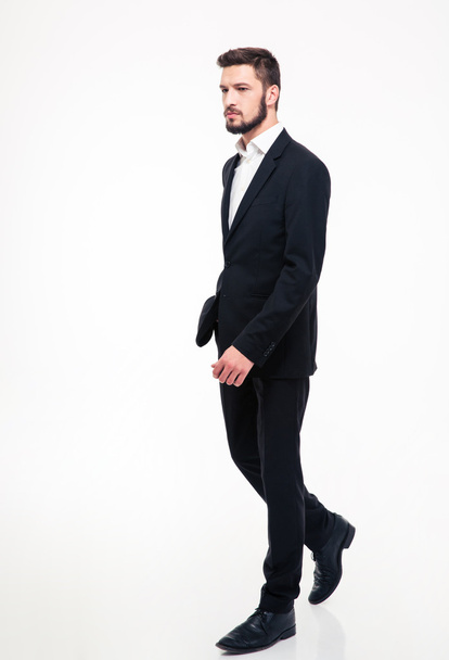 Full length portrait of a handsome businessman walking i - Photo, image
