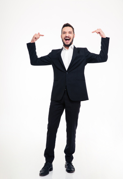 Handsome cheerful businessman in suit laughing and pointing on himself  - Foto, Bild