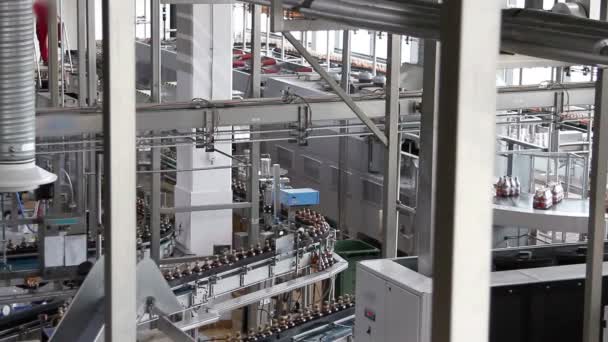 Plastic water bottles on conveyor or water bottling machine - Footage, Video