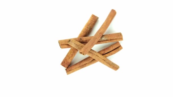Stick cinnamon, randomly on white background - Footage, Video