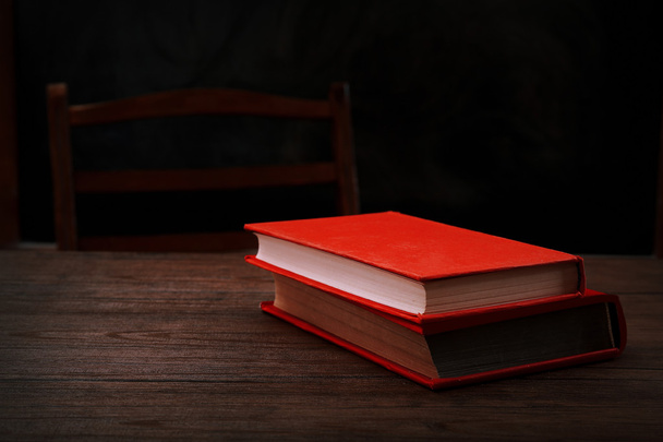 books on wooden table - Фото, изображение