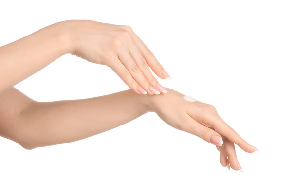 Health and body care theme: beautiful female hand with white cream isolated on a white background, hand massage - Zdjęcie, obraz