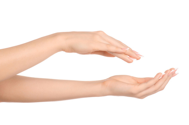 Health and body care theme: beautiful female hand with white cream isolated on a white background, hand massage - Φωτογραφία, εικόνα
