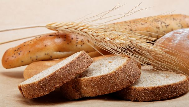 Fresh bread isolated on a light brown background. - Photo, Image