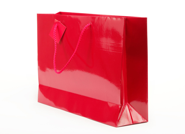 Red gift bag on a white background. - Zdjęcie, obraz