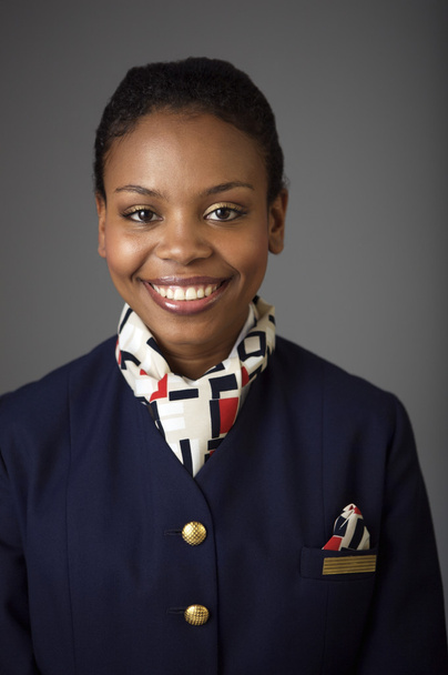 Lächelnde Stewardess in Uniform - Foto, Bild