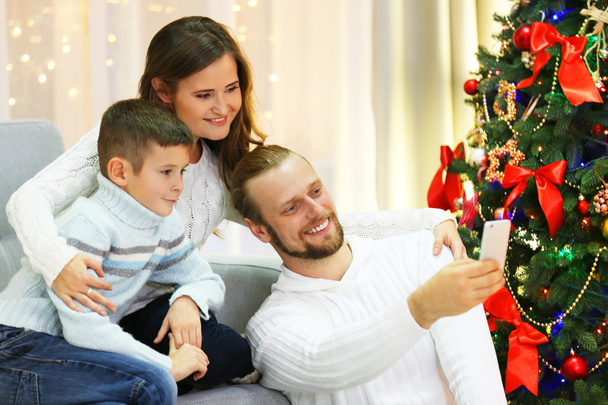 Happy family making photo in home holiday living room - Fotoğraf, Görsel