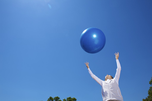 Woman with blue ball - Photo, Image