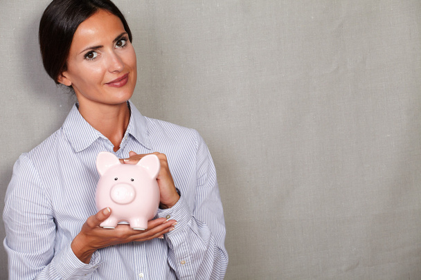 business woman holding piggy bank - Fotoğraf, Görsel