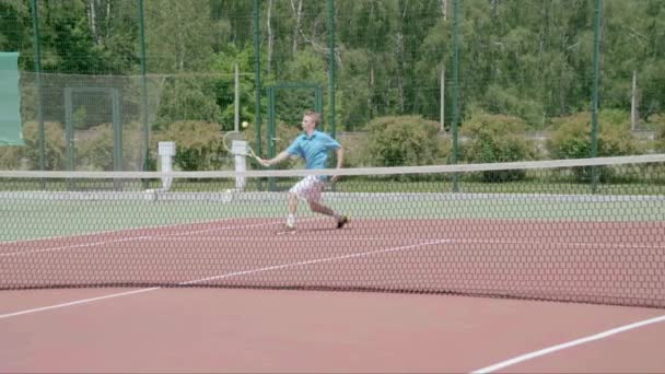 Tennis player hit a drop shot. Ball softly falls just after the net. Slow motion - Felvétel, videó