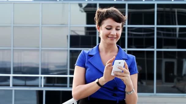 business woman with phone outdoors - Footage, Video