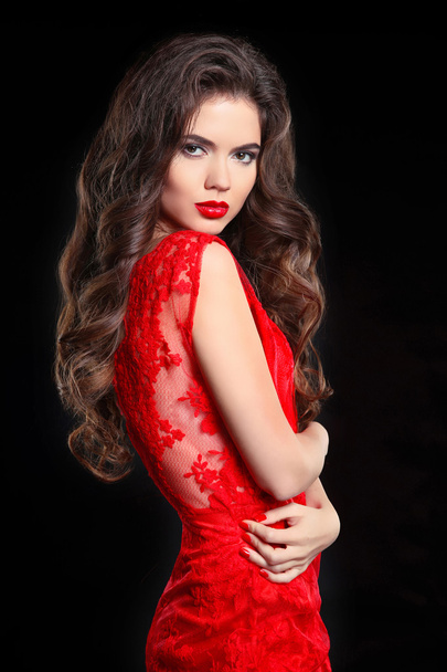 Long hair. Beautiful brunette woman in red lace dress. Beauty gi - Фото, зображення