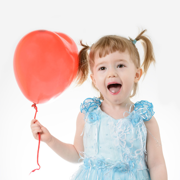 Menina em vestido azul segurando um balão
 - Foto, Imagem