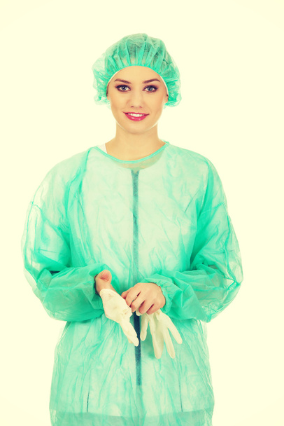 Woman doctor wearing medical gloves. - Fotó, kép