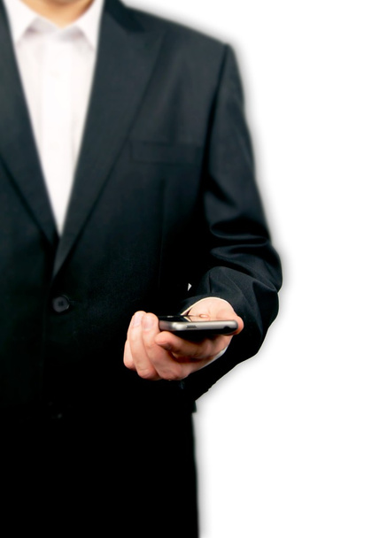 Man holding smartphone isolated on white - Photo, image