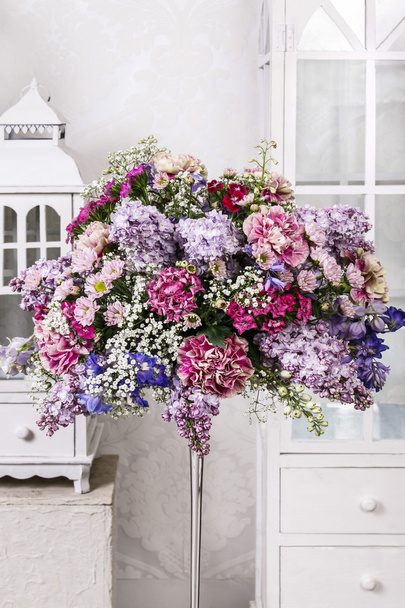 Bouquet of carnations, lilacs and chrysanthemums, wooden lantern - Valokuva, kuva