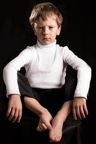 Portrait of the boy on a black backgroun - Photo, Image