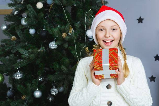 Happy girl holding gifts. Waiting for Christmas. Celebration. New Year. - Valokuva, kuva