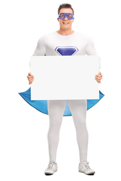 Superhero holding a blank signboard  - Foto, Bild