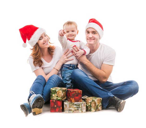 young couple with little boy and presents on the floor - Foto, Imagen