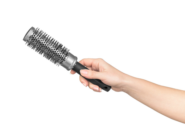female hand holds a professional hair brush on isolated white ba - Foto, immagini