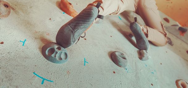 woman climbing artificial boulder - Photo, image