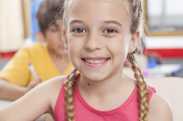 Girl looking at camera and smiling - Фото, изображение