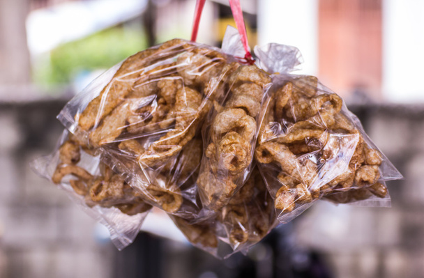 Pork crackling in plastic hang, Thai Market - Photo, Image