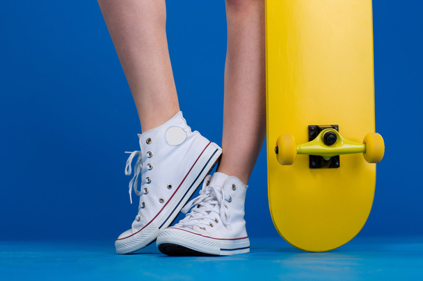 Female legs with skateboard - Foto, Imagen