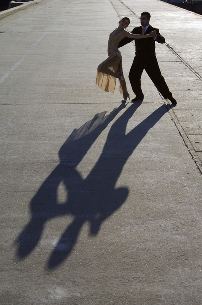 silhouettes of Couple dancing tango - Фото, изображение