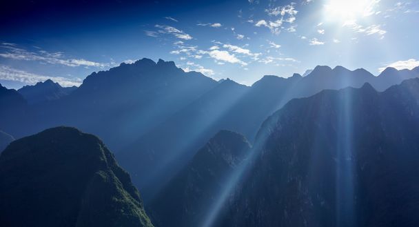 Sun rays seen in early morning over the mountains - Photo, Image