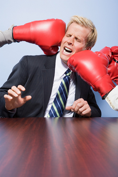 Businessman getting punched - Foto, immagini