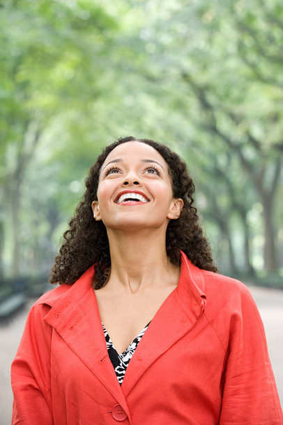 Woman looking up and smiling - Photo, Image
