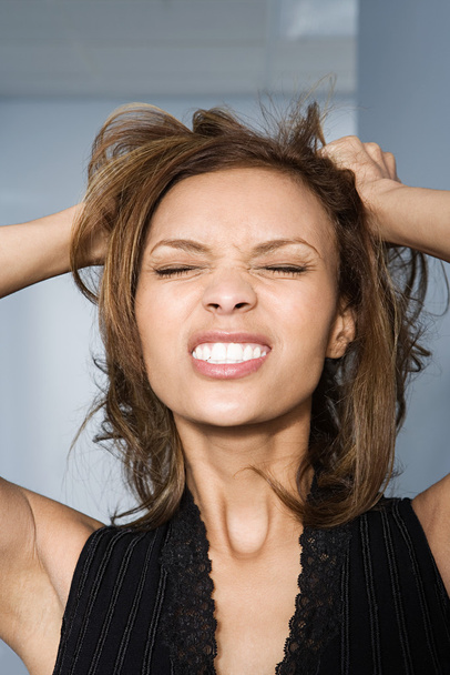 Businesswoman tearing her hair out - Photo, Image