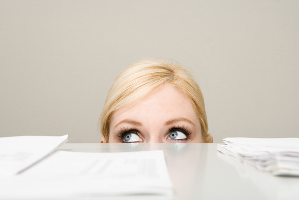 Woman behind filing cabinet - Photo, Image