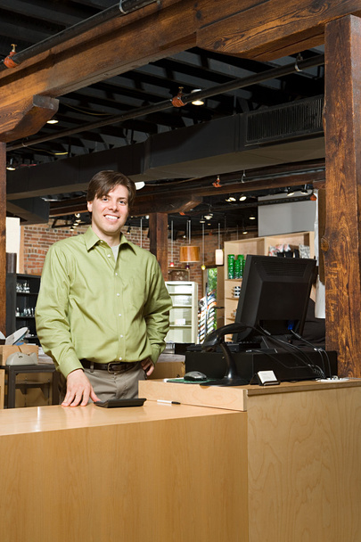 Shop assistant smiling at camera - Photo, Image