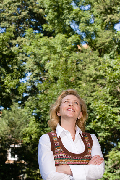 Woman outdoors looking up - Photo, Image