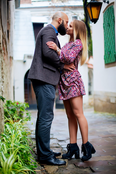 Landscape portrait of young beautiful stylish couple sensual and having fun outdoor in summer. - Photo, Image
