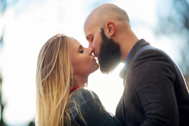 Loving couple on the sky background, kissing - Foto, Imagem