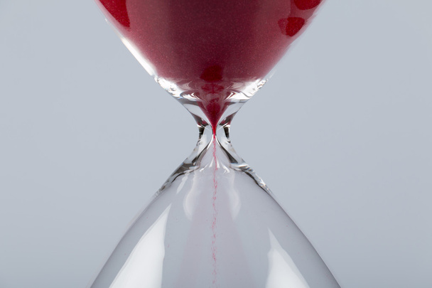 Red sand in an hourglass, horizontal - Photo, Image