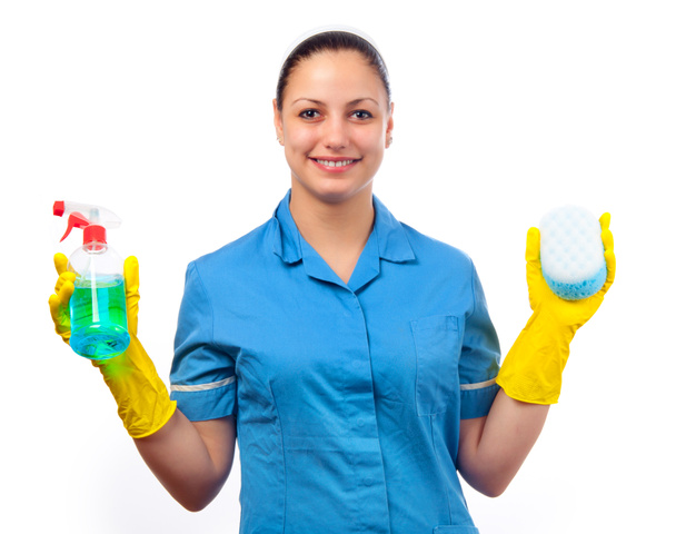 Smiling cleaning lady holding bottle of detergent in one hand and sponge in the other isolated on white - 写真・画像
