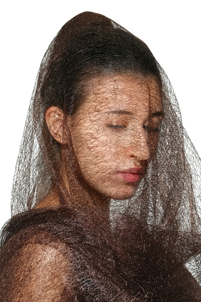 closeup portrait of lady in veil with closed eyes - Foto, afbeelding